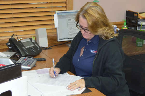 Woman writing at a desk